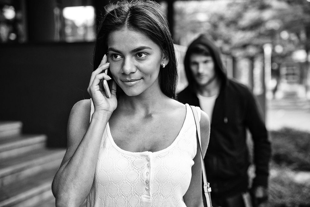 shutterstock image of a woman being stalked